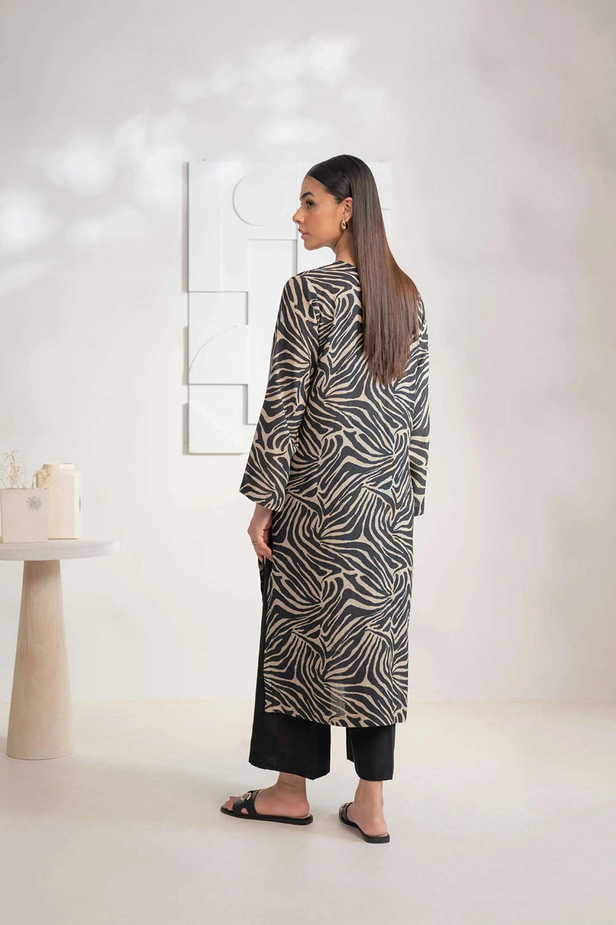 Women_s_black_Karandi_shirt_featuring_a_bold_zebra_print_shop_this_contemporary_piece_online_d10789cb-73ea-457c-9c77-3de5ebb1ac9f