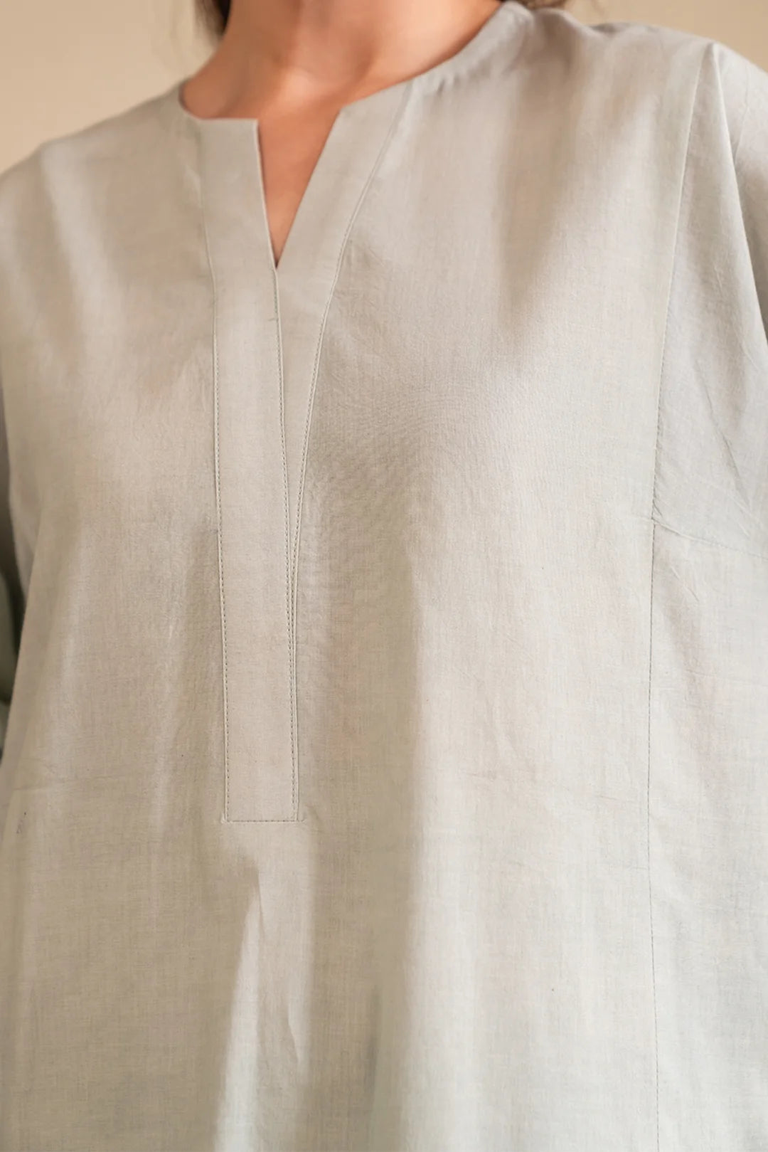 Women's pastel mint cambric suit with white embroidery – perfect for Eid & events.